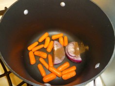 4 carrots and onion in pot